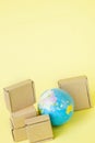 Earth globe is surrounded by boxes. Global business and international transportation of goods products. Shipping freight Royalty Free Stock Photo