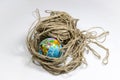 Earth globe on tangled rope yarn