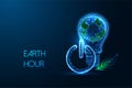 Earth Hour concept with Earth in a lightbulb, power button, and green leaf symbols. Royalty Free Stock Photo