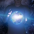 Earth hovers between mans hands Royalty Free Stock Photo