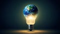 the earth inside a light bulb concept of green energy and environment Royalty Free Stock Photo