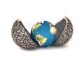 Earth in metall jacket Royalty Free Stock Photo