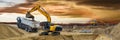 Earth mover and excavator at work in construction site Royalty Free Stock Photo