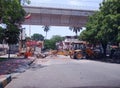 Earth mover parked across as a road barrier to prevent people moving during pandemic times