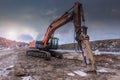 Earth moving by a bulldozer in the construction of a road in Spain. Hydraulic hammer for backhoe