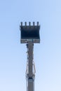 earth moving machine's arm and bucket isolated on blue sky Royalty Free Stock Photo