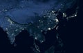 Earth at night, view of city lights showing human activity in India, China, South Korea and Japan from space. World dark map on