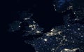 Earth at night, view of city lights showing human activity in UK, Netherlands and Belgium from space