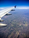 Earth and plane wing view from an illuminator Royalty Free Stock Photo