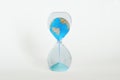 Earth planet in hourglass - Ecology, global warming, climate change concept Royalty Free Stock Photo
