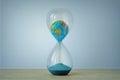 Earth planet in hourglass - Ecology, global warming, climate change concept Royalty Free Stock Photo