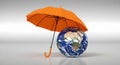 Earth protected by an orange umbrella, a concept of environmental protection Royalty Free Stock Photo