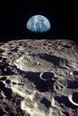 Earth rises above lunar horizon.