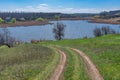 Earth road leading down to Suha Sura river in Vasylivka village near Dnepr city