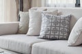 Earth tone sofa set with varies pattern pillows in living room Royalty Free Stock Photo