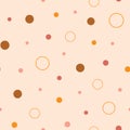 Earth tones dots and circles seamless repeat pattern. Hand-drawn dots and circles in different sizes, vector