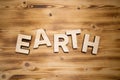 EARTH word made with building blocks on wooden board