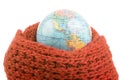 earth world globe in a warm scarf on a white background. global warming of the atmosphere. world weather