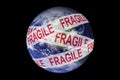 Earth wrapped in fragile tape. Environmental awareness, ecology concept Royalty Free Stock Photo