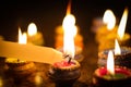 Earthen diya lamp lighting with candles on the occasion of diwali and sandhi pujo Royalty Free Stock Photo