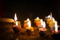 Earthen diya lamp lighting with candles on the occasion of diwali and sandhi pujo Royalty Free Stock Photo