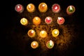 Earthen diya lamp lighting with candles on the occasion of diwali and sandhi pujo Royalty Free Stock Photo