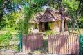 Earthen house under shade of trees. An earth house, also known as earth berm, earth sheltered home, or eco-house is an architectur Royalty Free Stock Photo