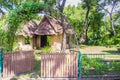 Earthen house under shade of trees. An earth house, also known as earth berm, earth sheltered home, or eco-house is an architectur Royalty Free Stock Photo