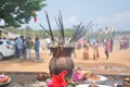 Earthen lamps and incense sticks in a temple with some flowers to worship lord Shiva