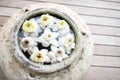 Earthenware jar decorated with lotus on wooden floor. Royalty Free Stock Photo