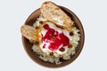 Plate with cottage cheese, sultana, slices of bread, flavored with and sour cream and fresh honey