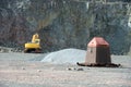 Earthmover in an active quarry mine of porphyry rocks. digging. Royalty Free Stock Photo