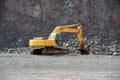 Earthmover in an active quarry mine of porphyry rocks. digging. Royalty Free Stock Photo