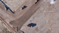 Earthmoving equipment. Aerial view of a large construction site with several earthmoving machines. Royalty Free Stock Photo