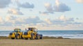 Earthmoving equipment machines working at the beach for maintenance moving sand industrial agriculture Royalty Free Stock Photo