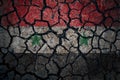 Earthquake in Syria. Flag of Syria on cracked ground. Cracked flag of Syria