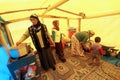 Earthquake victims women are cooking in the tent