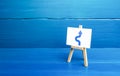 An easel with a curved arrow avoiding an obstacle. Deviation from route, side mission. Maneuvering, taking right action. Royalty Free Stock Photo