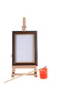 Easel, paint and small brush