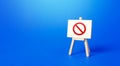 Easel with the prohibition sign NO on a blue background. Restricted area. Restrictions and Sanctions. Out of stock. Ban