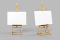 Easel stand board with blank white poster isolated. Wooden easel art painting paper frame stand or poster Royalty Free Stock Photo