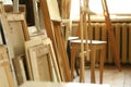 Easels and tablets made of light wood in art workshop