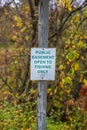 Easement sign to notify public fishing is allowed. Selective focus, background and foreground blur. Royalty Free Stock Photo