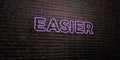 EASIER -Realistic Neon Sign on Brick Wall background - 3D rendered royalty free stock image