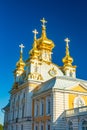 East Chapel of Petergof Palace in St. Petersburg. Russia, golden domes of beautiful palace building against the blue sky