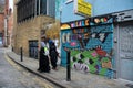 East End, London, street art and Muslim women Royalty Free Stock Photo