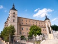 East facade of the Alcazar de Toledo and monument to the Siege