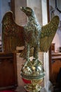 Decorative brass eagle lectern in St Swithuns Church , East Grinstead, West Sussex on