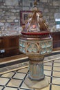 Decorative font in St Swithuns Church , East Grinstead, West Sussex on March 28, 2022