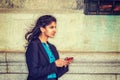 East Indian American college student texting outside in New York Royalty Free Stock Photo